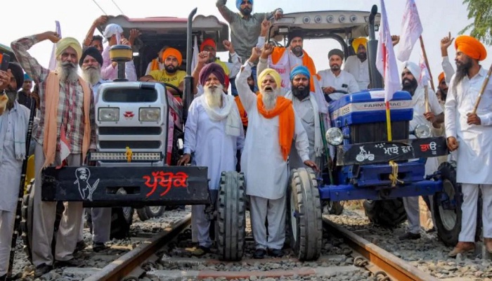 Farmers on railway tracks