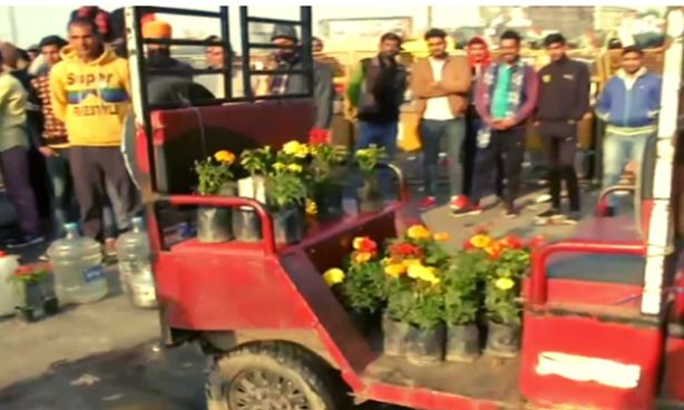 Farmers at Ghazipur border plant flowers