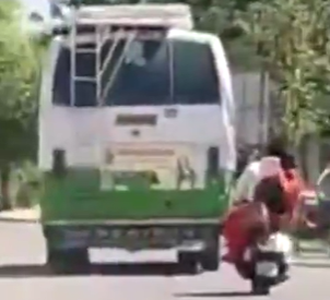 Woman running behind the Govt bus