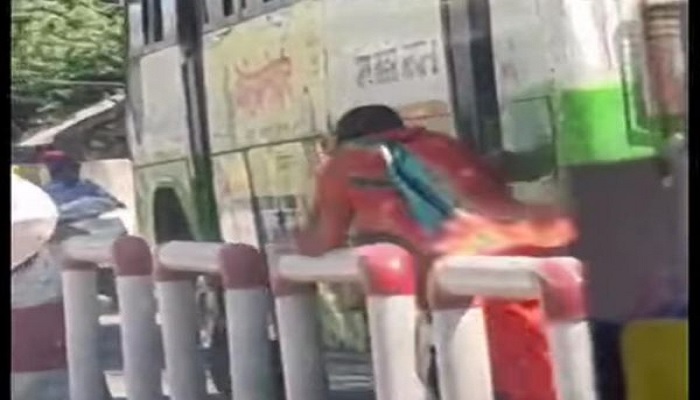 Woman running behind the Govt bus