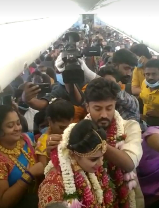 couples did wedding in sky by renting a plane