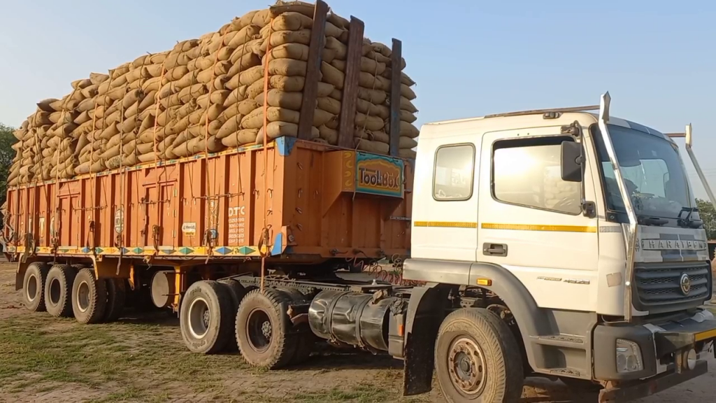 Three trucks of paddy surrounded