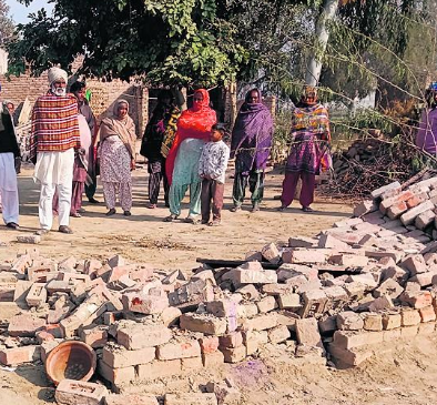 demolishes house with tractor