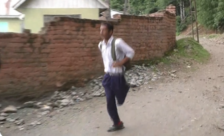 Kashmiri boy walks 2 