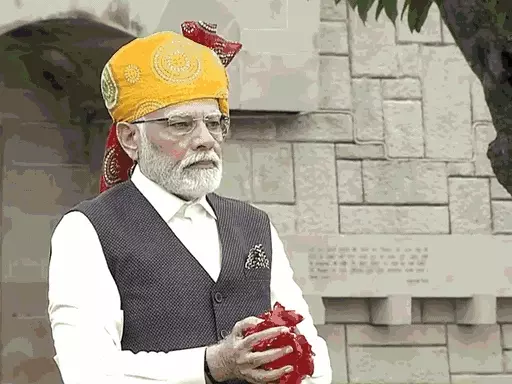PM Modi in saffron colored